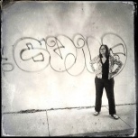 Gina looking fierce in front of unwanted graffiti